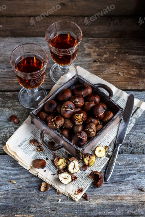 Preview: Roasted chestnuts in an old box. Selective focus.