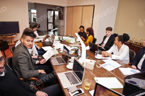 Preview: Multiracial young creative people in modern office