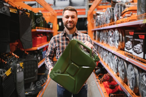 Preview: A male customer stands in an auto parts store with a jerry can
