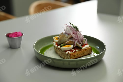 Preview: Tasty sandwich with fish on light table