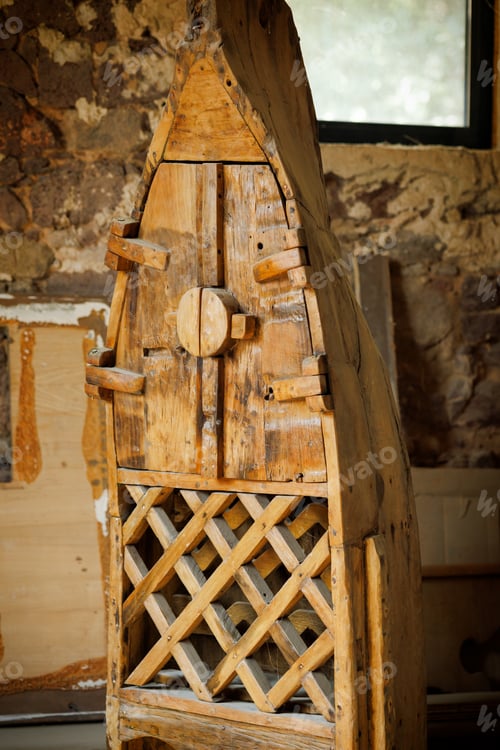 Preview: Wooden old wine cabinet in the shape of a boat in the basement of the house