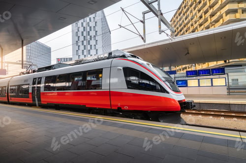Preview: High speed train on the train station at sunset in Vienna