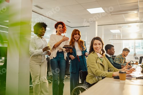 Preview: Multiracial people surprising colleague with disability with birthday cake