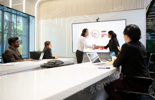 Preview: Business people having a meeting and present in a conference room at the office.