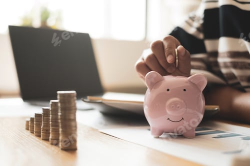 Preview: Woman's hand. putting coins in the piggy bank with coins, saving money with coins, stepping into