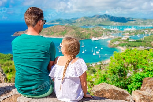 Preview: Family enjoying the view of picturesque English Harbour at Antigua in caribbean sea