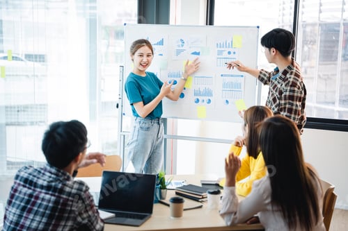 Preview: Successful business people present analytics reports while working with colleagues in the modern off