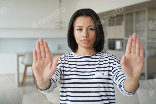 Preview: Woman gesturing no with hands, shows rejection. Stop abuse and domestic violence.