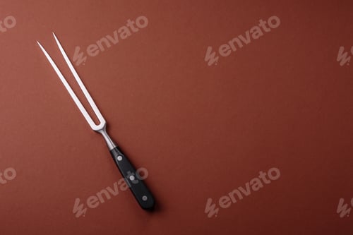 Preview: Empty meat or steak fork with vegetables, spices and other ingredients. Meat fork