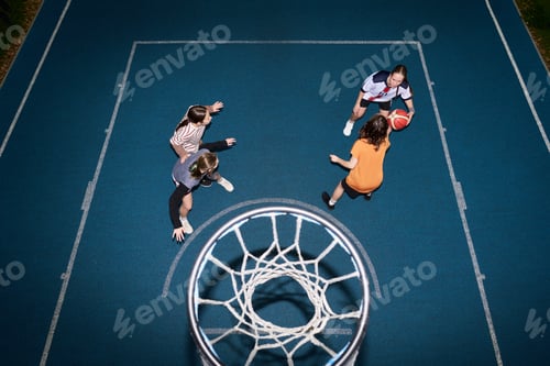 Preview: Teenage Girls Competing in Fast Paced Streetball Game Outdoors