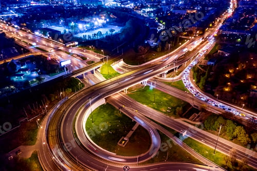 Preview: Night Aerial view of a freeway intersection traffic trails in ni
