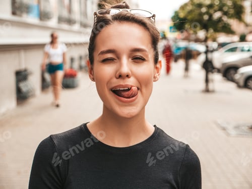 Preview: Portrait of young funny woman posing outdoors