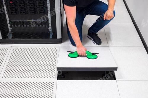 Preview: Computer Engineer Pulling Floor Tile Using Suction Cups In Datac