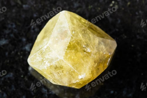 Preview: rough green grossular garnet crystal on black