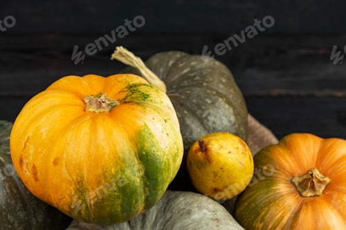 Preview: Pumpkins and pears on wooden table close-up