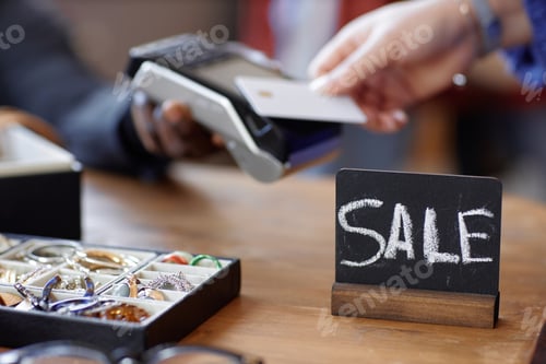 Preview: Sale Sign on Checkout Counter at Thrift Store