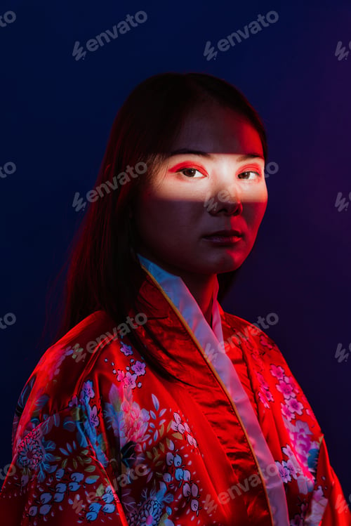 Preview: Asian woman wearing traditional kimono with red light