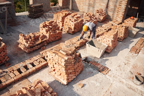 Preview: Top view. Handsome Indian man is on the construction site