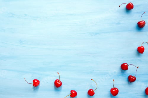 Preview: background of cherries and leaves on blue