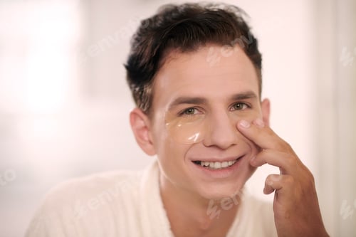 Preview: Man Applying Patches on Face
