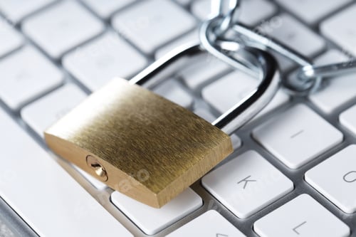 Preview: Cyber safety. Metal padlock and chain on computer keyboard, closeup