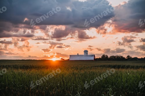 Preview: Indians sunrise with dramatic clouds over a barn