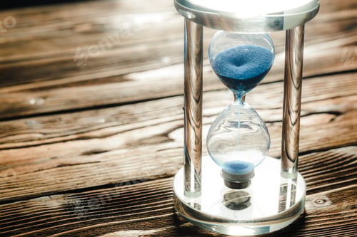 Preview: Modern hourglass on wooden background