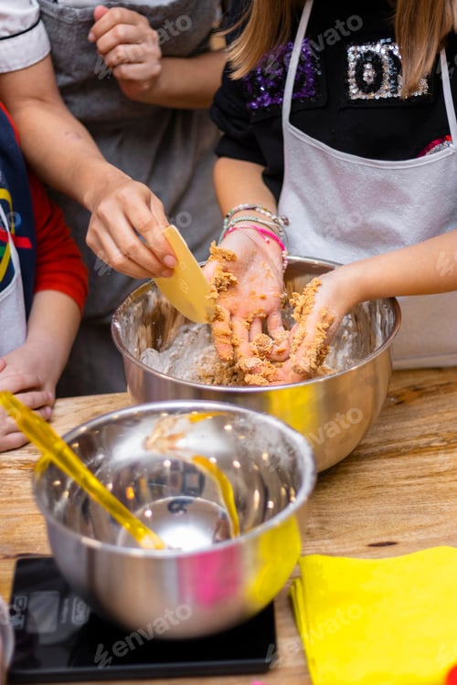Preview: Christmas cookie workshops. Children kneading cookies.