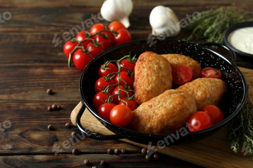 Preview: Concept of tasty food with cutlets on wooden table