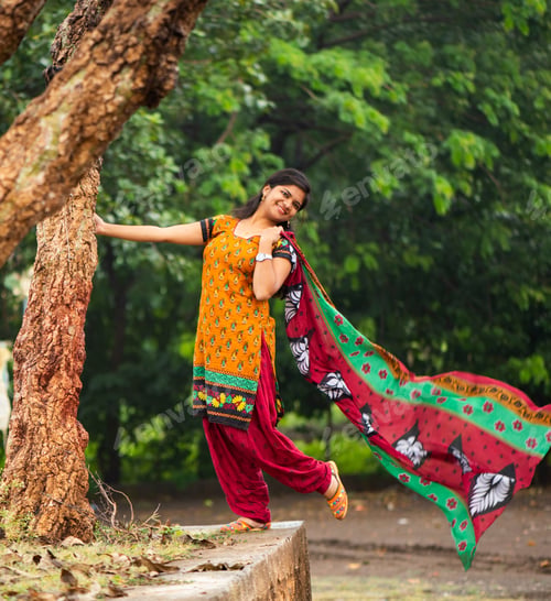 Preview: Young girl near tree trunk and she enjoying fresh air outdoors