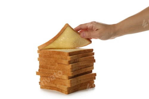 Preview: Female hand and pile of toast bread isolated on white background