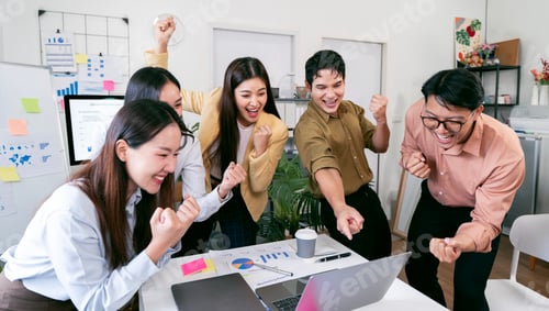 Preview: A cheerful and diverse business team celebrates a successful project