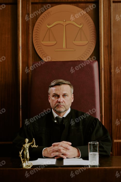 Preview: Portrait of Middle Aged Caucasian Man Sitting as Judge in Courtroom