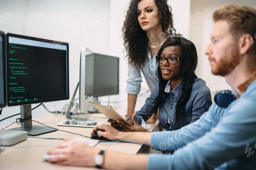 Preview: Programmers cooperating at information technology company