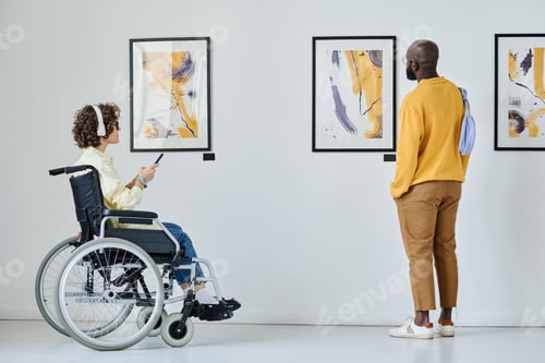 Preview: People examining modern art at gallery