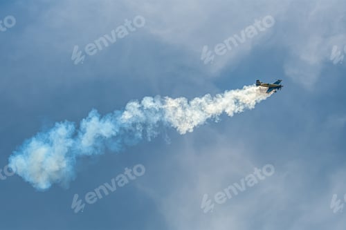 Preview: The aerobatic plane with smoke track in the sky