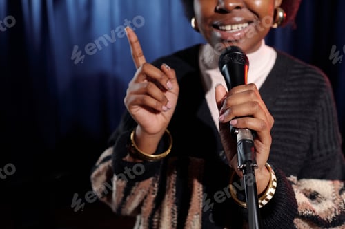 Preview: Comedian gesticulating during monologue