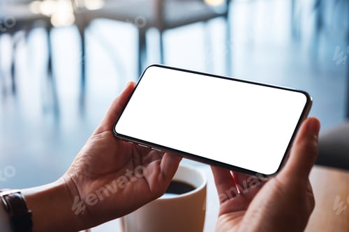 Preview: Mockup image of a woman holding mobile phone with blank white desktop screen