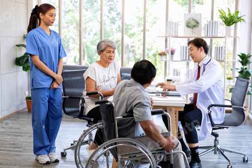 Preview: Senior couple male on wheel chair having consultations with doctor for their sickness at clinic