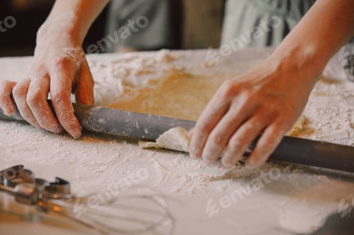 Preview: Closeup view on hands how mother with son preparing flour for cookies in the kitchen