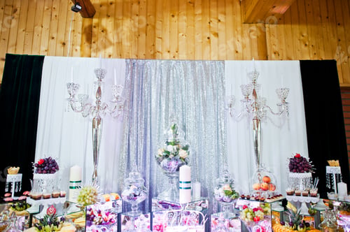 Preview: Elegance wedding reception table with food and decor.