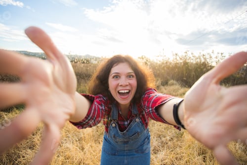 Preview: Travel, vacation and holiday concept - Happy young woman having fun taking selfie against background