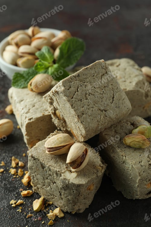 Preview: Concept of tasty food with halva on dark textured background