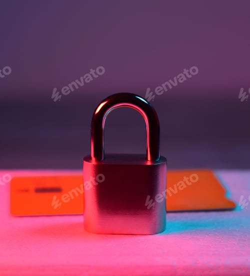Preview: Padlock near some credit cards - caution and security when making credit card payments concept