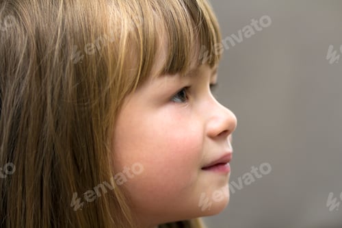Preview: Close-up portrait of pretty little girl. Smiling child