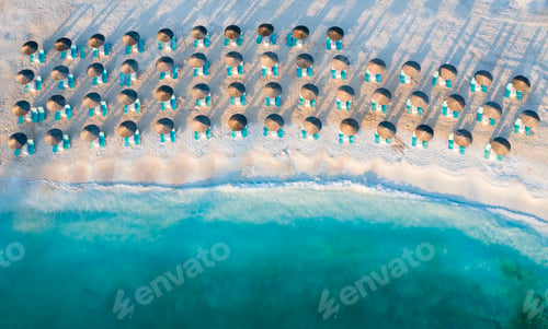 Preview: Beach, beautiful waves, blue water at sunrise. Top view from drone.