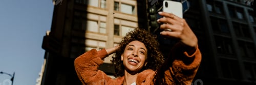 Preview: Black female blogger recording her live in downtown