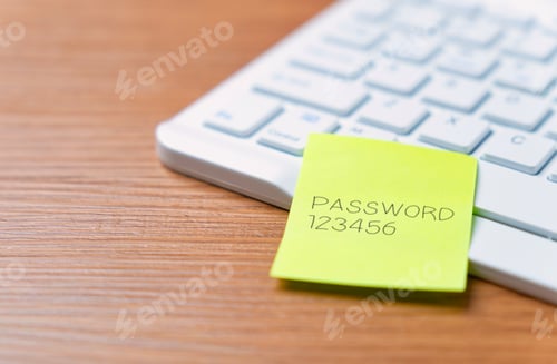 Preview: Sticky note with the word "password 123456" on a laptop keyboard.