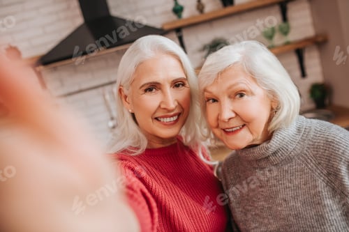 Preview: Two mature grey-haired positive ladies making selfies