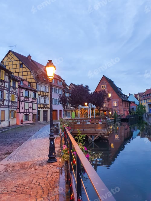 Preview: Charming canalside evening in colorful Alsatian village with historic timber-framed houses